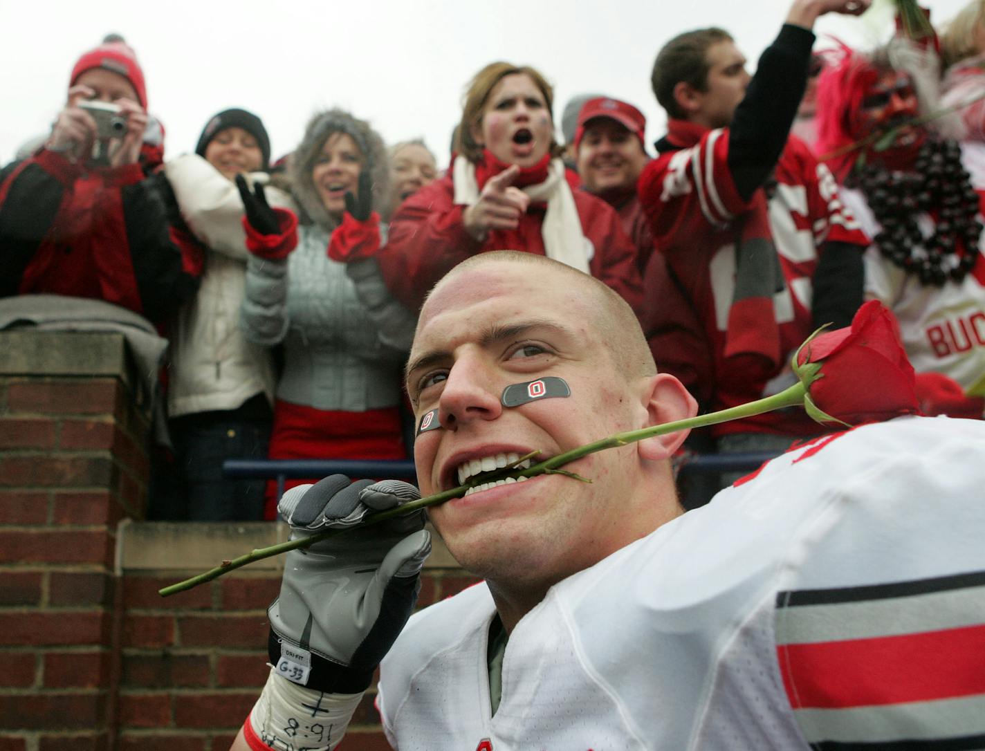 ** FILE ** In this Nov. 17, 2007 file photo, Ohio State linebacker James Laurinaitis celebrates with fans after beating Michigan, 14-3, in a college football game in Ann Arbor, Mich. It's highly unlikely there will be any bigger Oklahoma or Pittsburgh fans on Saturday than the Ohio State Buckeyes. Should the Sooners upend top-ranked Missouri in the Big 12 championship game, or if the Panthers could somehow upset No. 2 West Virginia in their regular-season showdown, the third-ranked Buckeyes woul