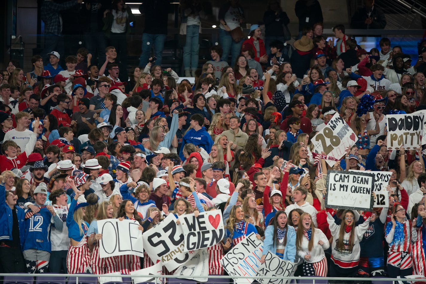 The Lakeville South High School student section celebrates after quarterback Camden Dean (12) scored a touchdown in the fourth quarter to take a 13-7 lead over Maple Grove High School in the Minnesota High School football Class 6A State Championship Friday, Nov. 26, 2021 at U.S. Bank Stadium in Minneapolis. ]