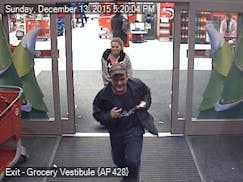 Fridley police are looking for this pair, seen running from a Target store in Fridley after a gun they had discharged.