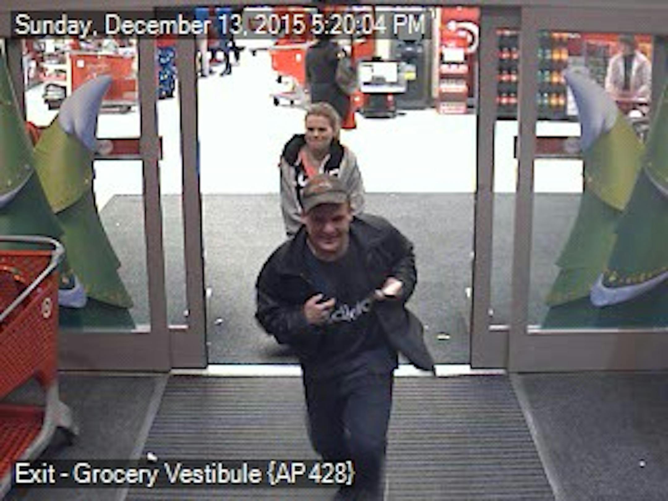 Fridley police are looking for this pair, seen running from a Target store in Fridley after a gun they had discharged.