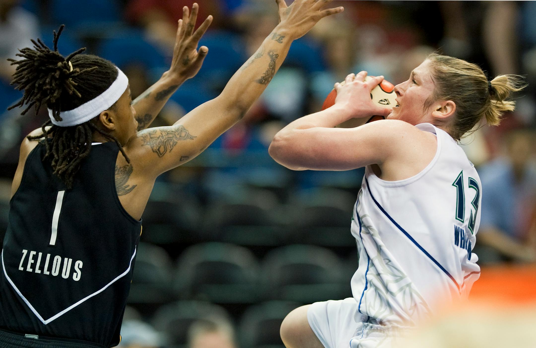Lynx guard Lindsay Whalen scored over Tulsa's Shavonte Zellous during Sunday's game at Target Center. Whalen finished with 16 points, but the Shock bolted to a 9-0 lead on its way to a 94-82 victory.