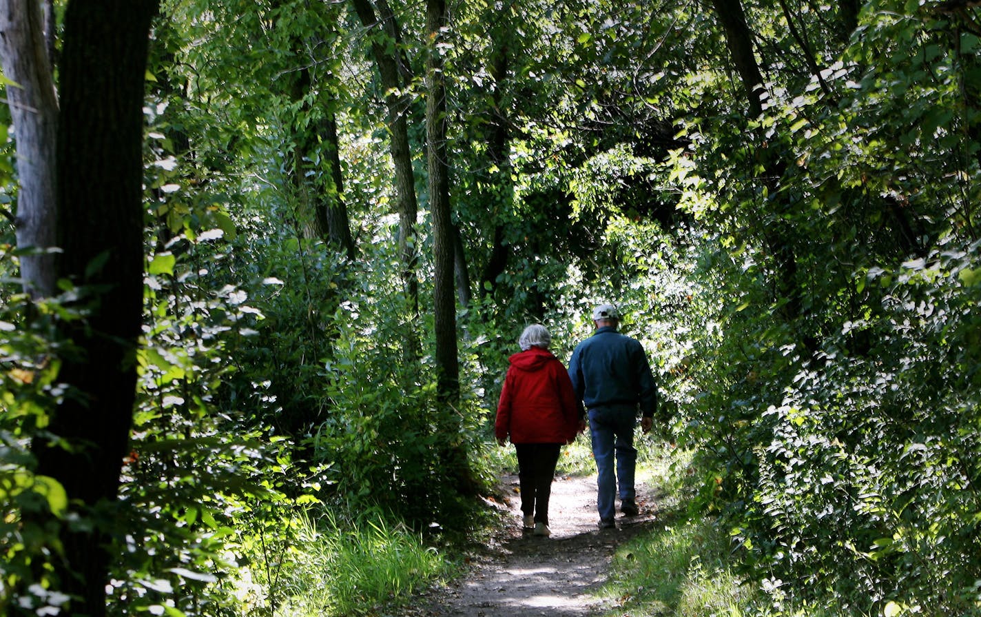 DAVID JOLES &#x2022; djoles@startribune.com
Dakota County MN - Sept. 14, 2007 - Tim and Sandy Buschert of Roseburg, OR, head down a trail along Jensen Lake in Lebanon Hills Regional Park. The couple had be recommended the trail by their son Ryan Buschert who lives in Lakeville.