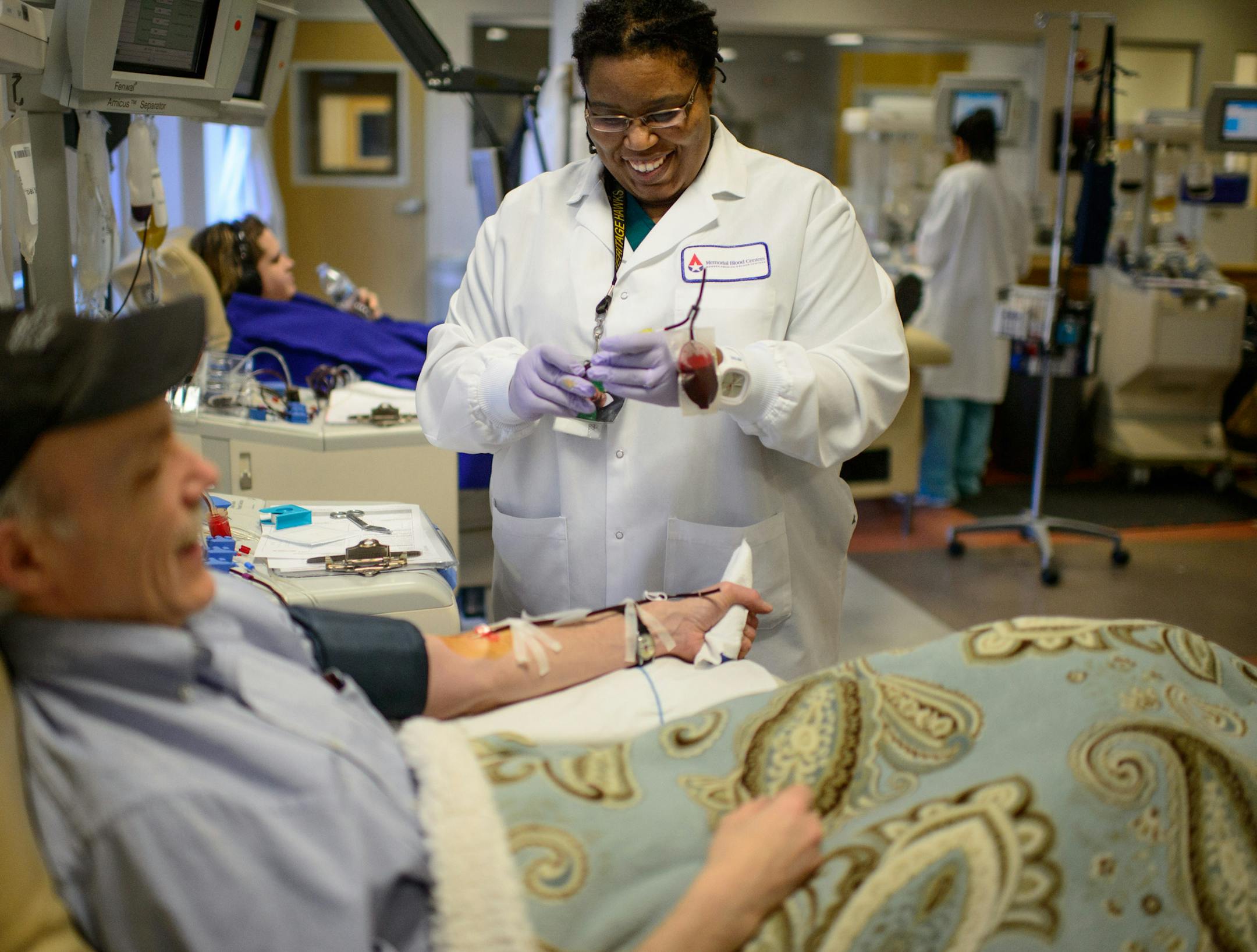 Phlebotomist Leah Thompson watched over Jim Irvine during a blood donation Tuesday at a Memorial Blood Center, part of Blood Centers of America, in St. Paul.