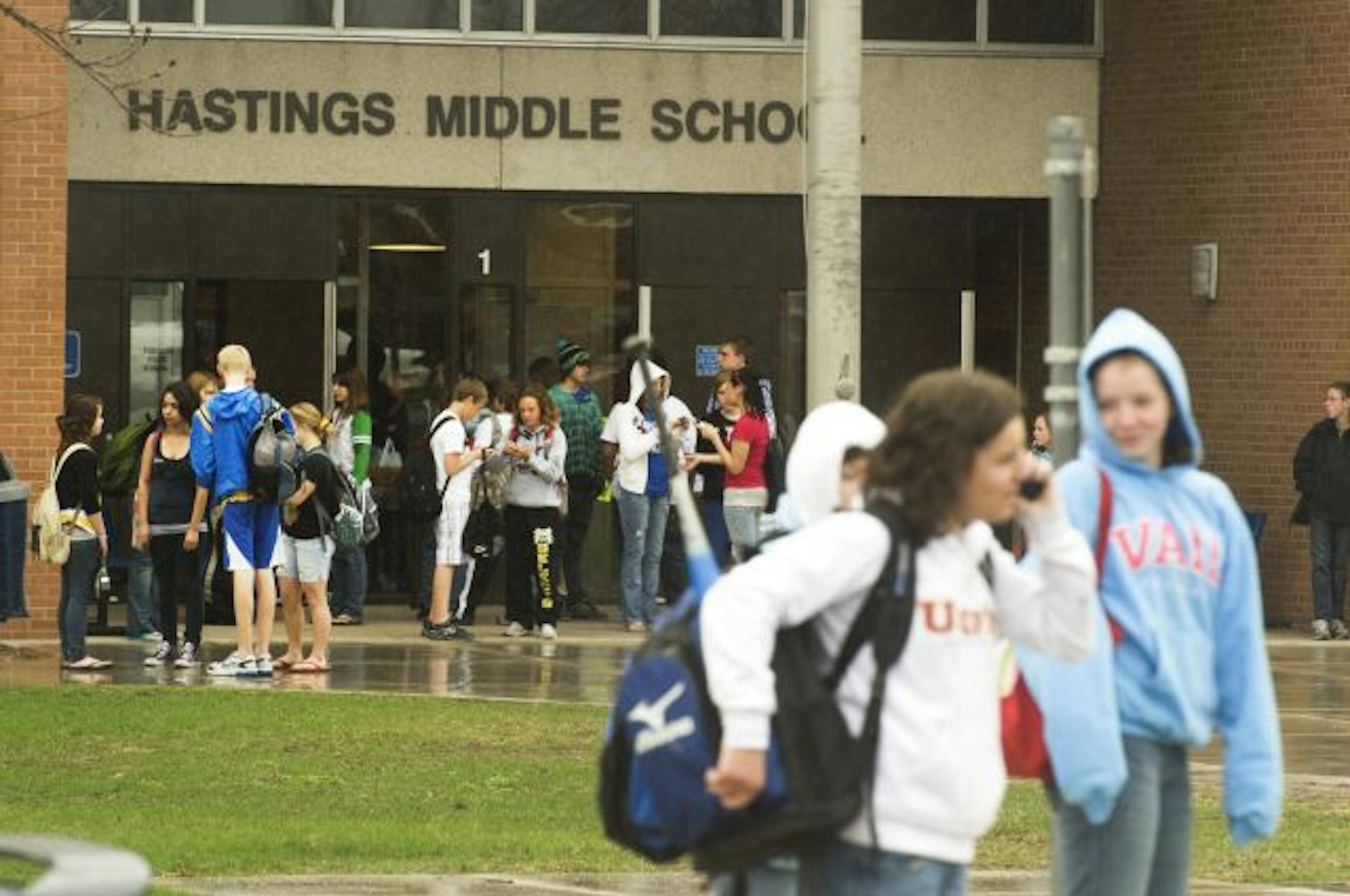 Students leave Hastings Middle School the day after a fellow student prompted a lockdown when he brandished a revolver in classrooms and hallways. No one was physically hurt in the incident.