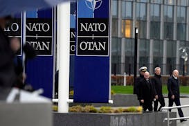 NATO Secretary General Jens Stoltenberg, second right, arrives for a wreath laying ceremony at NATO headquarters in Brussels, April 4, 2024.