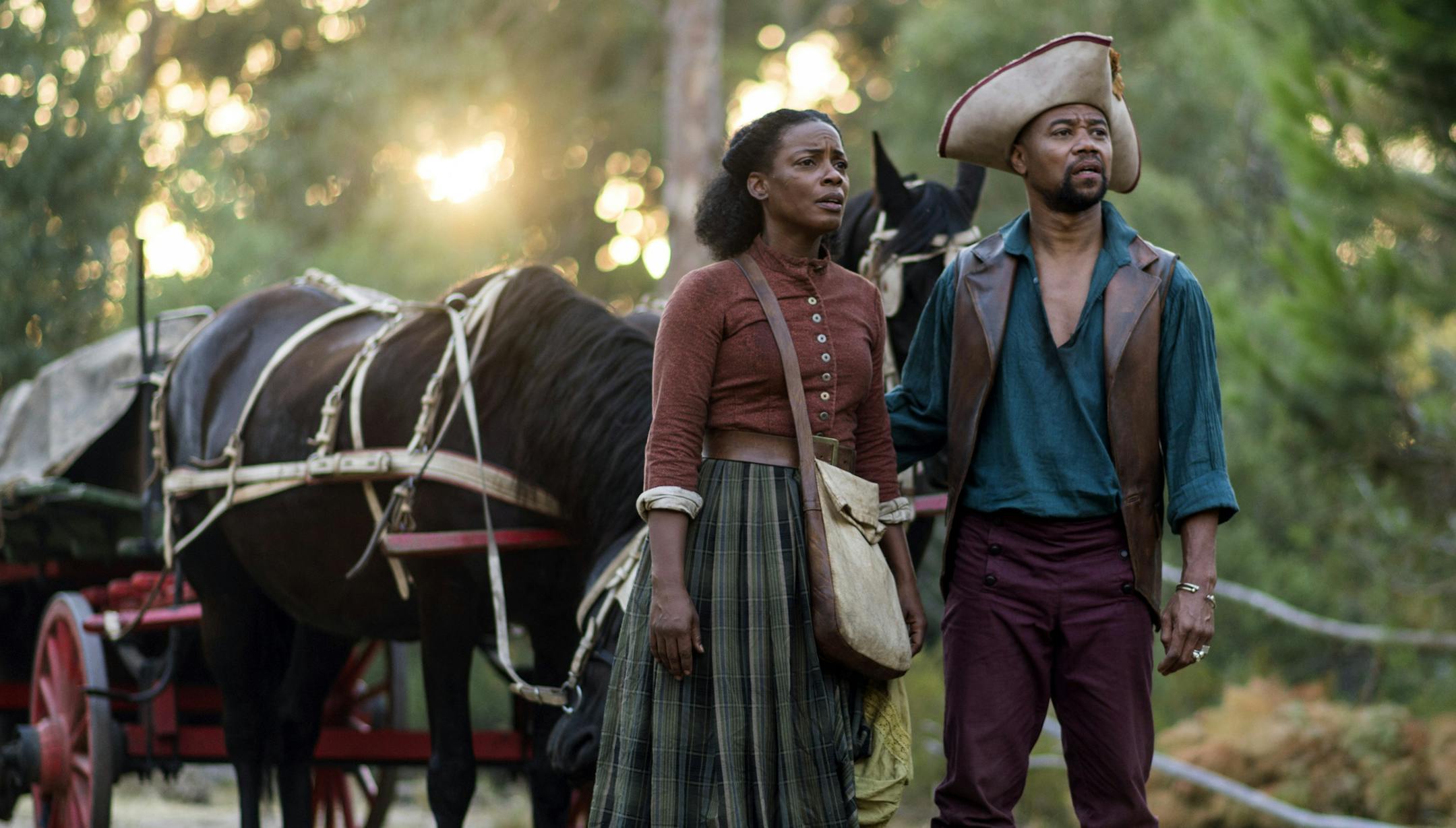 This image released by Entertainment One/BET shows Aunjanue Ellis, left, and Cuba Gooding Jr. in a scene from "The Book of Negros," a six-part miniseries starting Monday Feb. 16, at 8PM ET/PT. (AP Photo/Entertainment One/BET, Joe Alblas)