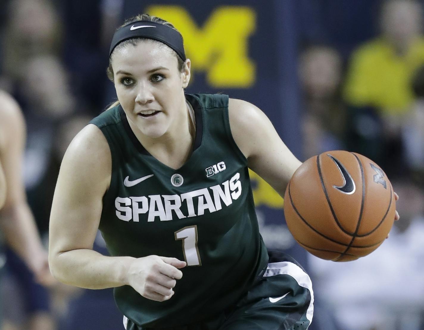 Michigan State guard Tori Jankoska brings the ball up court during the second half of an NCAA college basketball game against Michigan, Sunday, Feb. 19, 2017, in Ann Arbor, Mich. (AP Photo/Carlos Osorio) ORG XMIT: otkco115