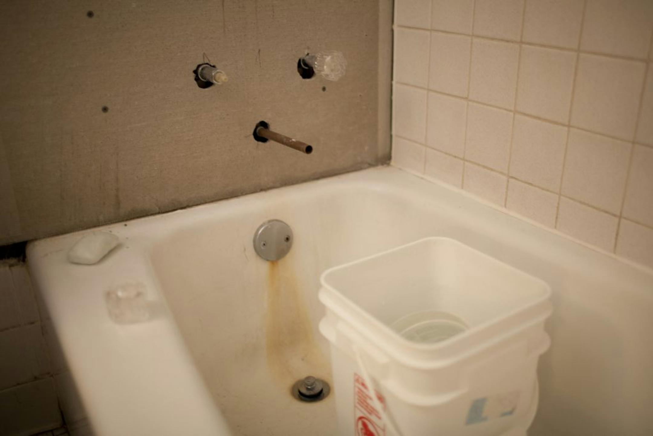 The bathtub has no fixtures in one of the units at the Country Village Apartments in Burnsville, Minn., Wednesday evening, October 19, 2011. Mold, holes in walls, plumbing that won't shut off, sagging ceilings, sopping wet carpets, cockroaches and even a toad are what Burnsville inspectors found at Country Village Apartments earlier this year. They've been building a case and now the city council suspended the owner's rental license for two months, putting them on notice that their license may n