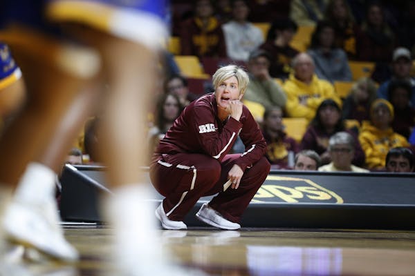 Head coach Marlene Stollings of Minnesota calls plays from the sideline during the second half.