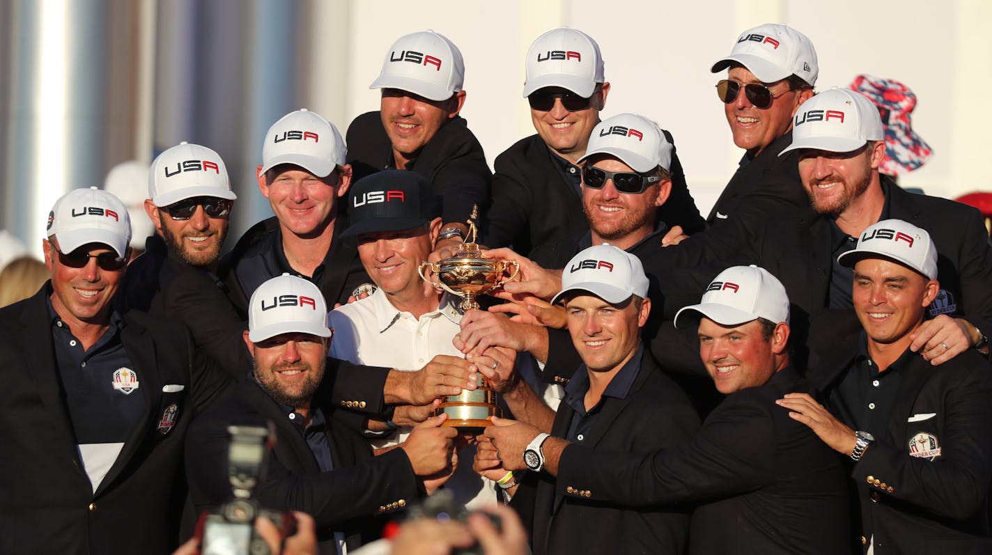 US team posed with the Ryder Cup during the closing ceremonies.