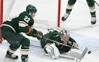 With the help of forward Kevin Fiala, Wild goalie Alex Stalock tried to cover the puck during Minnesota's 3-2 win over Colorado on Thursday night at X