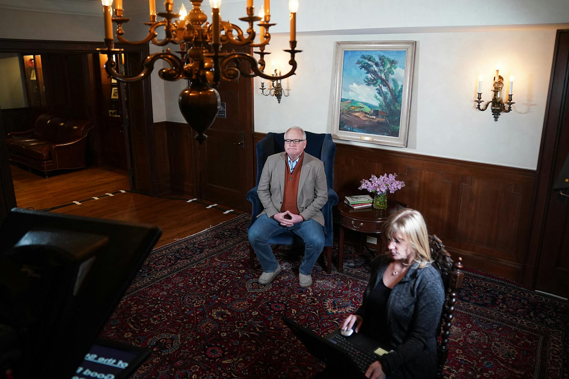 Minnesota Gov. Tim Walz prepared to deliver his State of the State address over YouTube from his residence. At right is prompter operator Laura Hammerbeck.