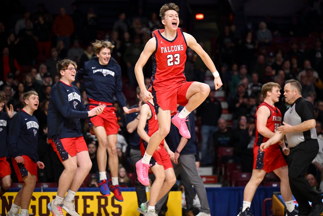 Fertile-Beltrami guard Caiden Swenby (23) celebrates an 84-75 triple-overtime win against West Central Area in Friday's Class 1A semifinals at Williams Arena.