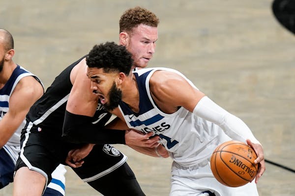 Karl-Anthony Towns of the Wolves drove past Brooklyn’s Blake Griffin during a game in New York on March 29.