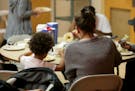 Women and children ate lunch at the Project Home Day Center, Ramsey County's only day shelter for homeless families, on Sept. 19 in St. Paul.