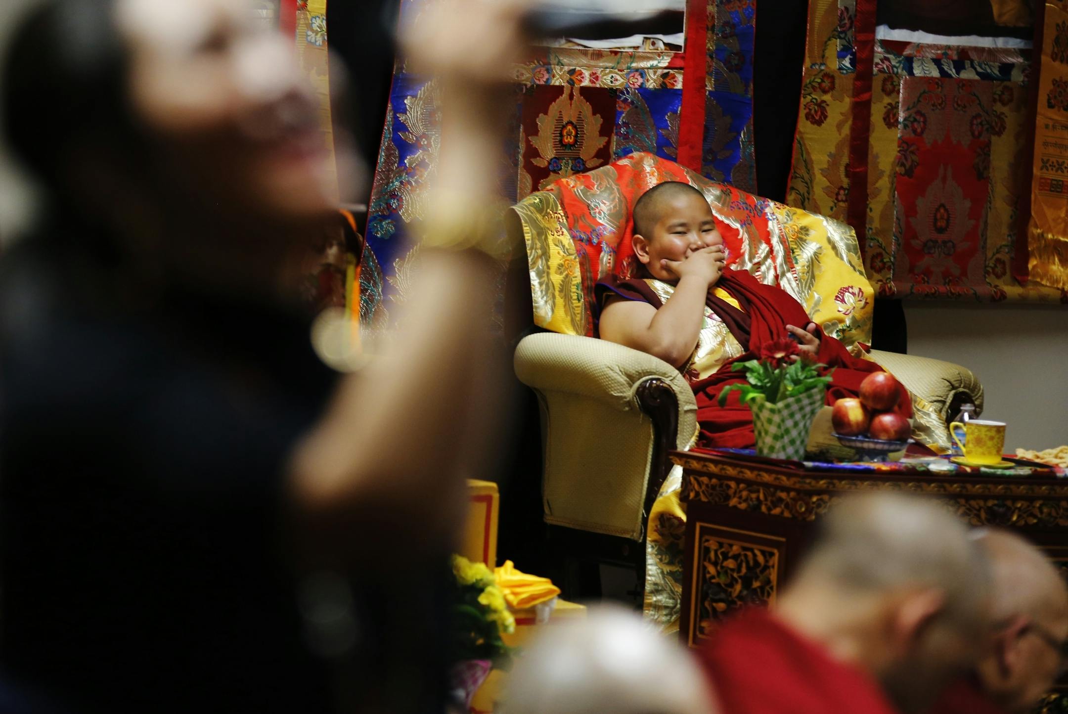 Jalue Dorjee,9, presided over a religious ceremony at the Tibetan American Foundation in St. Paul where he was the guest of honor.