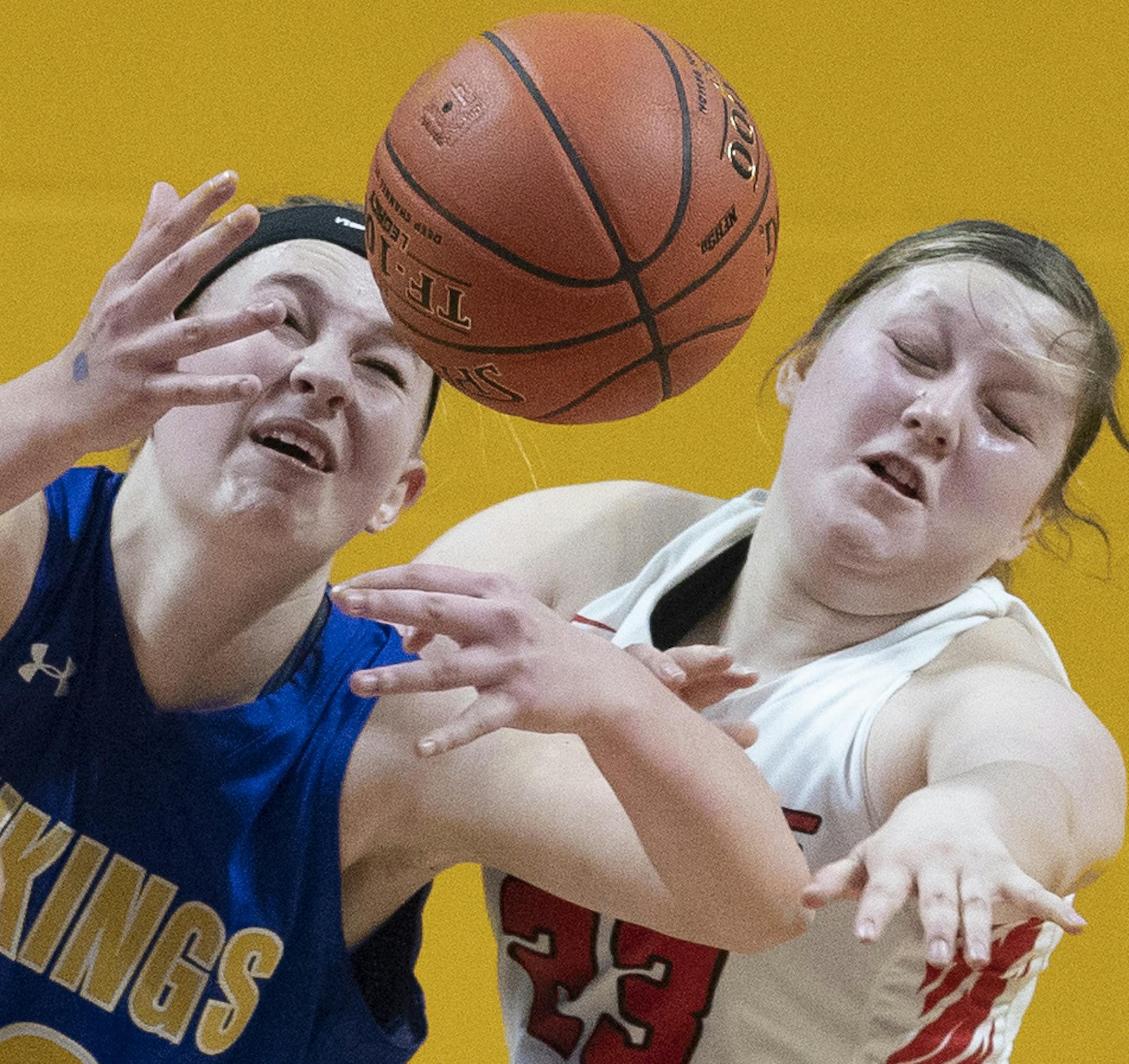 Morgan Hennen left of Minneota battled Autumn Holthusen for a rebound during 1A quarterfinals Thursday at Maturi Pavilion March 14, 2019 in Minneapolis MN.] Minneota vs. Red Lake game one of the 1A girls' basketball state tournament quarterfinals at Maturi Pavilion . Jerry Holt • Jerry.holt@startribune.com