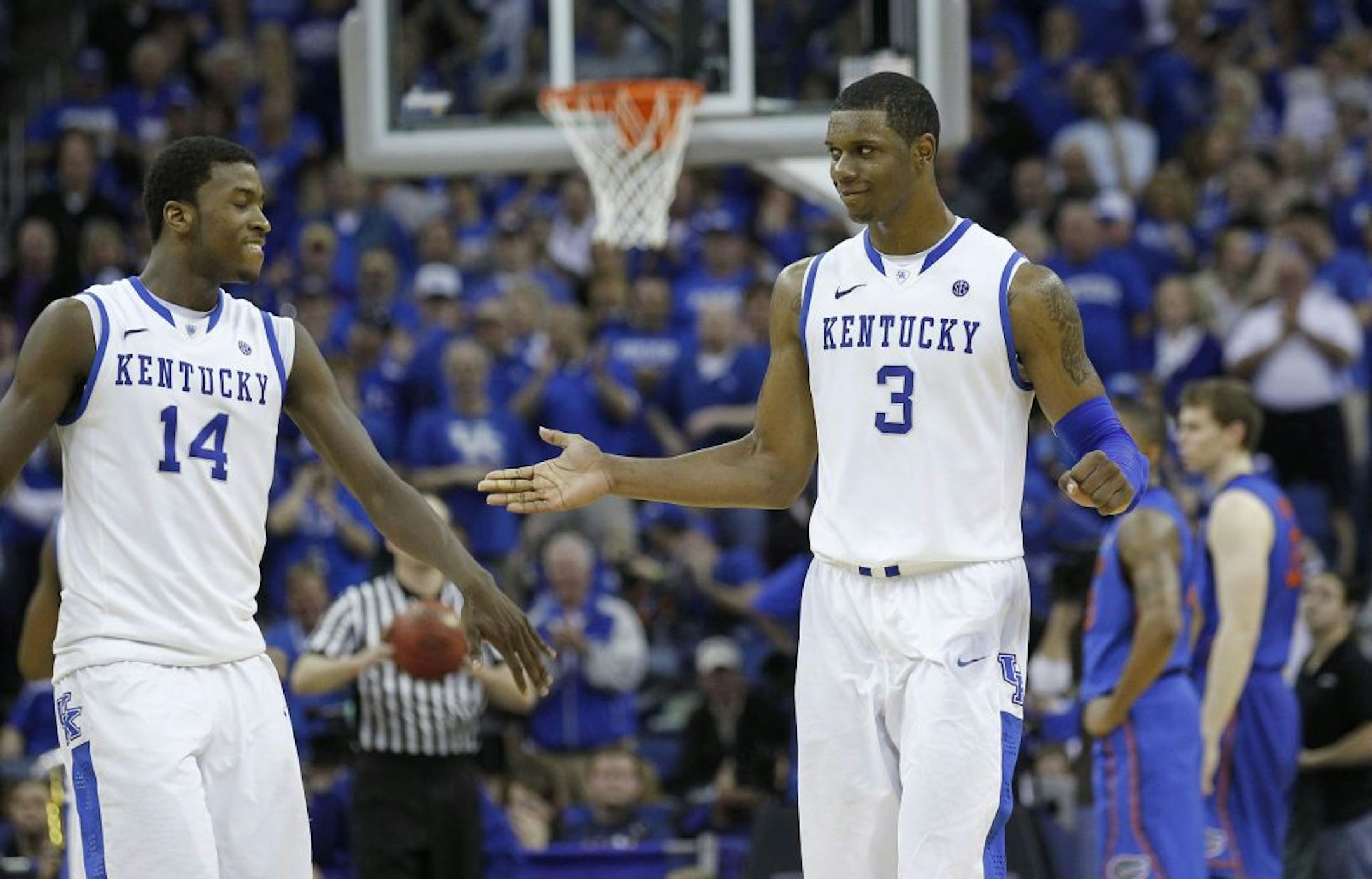 Kentucky forward Terrence Jones (3) and forward Michael Kidd-Gilchrist (14)
