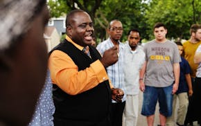 Bishop Harding Smith led a vigil for the victim of a fatal shooting on Plymouth Avenue in north Minneapolis.