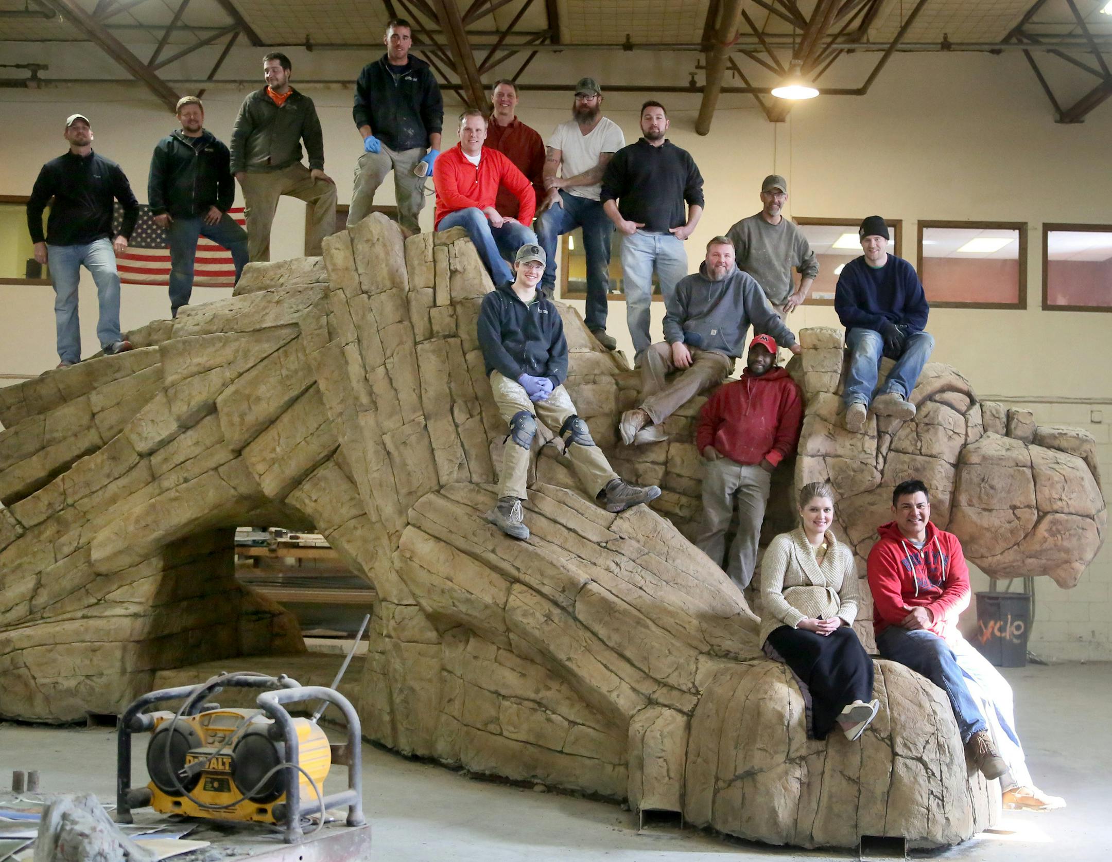 Themed Concepts, a Forest Lake business that builds and installs fiber reinforced concete playground equipment for businesses, theme parks and water parks nationally and internationally, recently completed this 25,000 pound mountain lion. The sculpture, made of rebar, structural steel and glass fiber reinforced concrete was seen with crew members at the plant Thursday, Feb. 19, 2015 in Forest Lake, MN and will be trucked to Phoenix, AZ, to go in a park as a playground.](DAVID JOLES/STARTRIBUNE)d