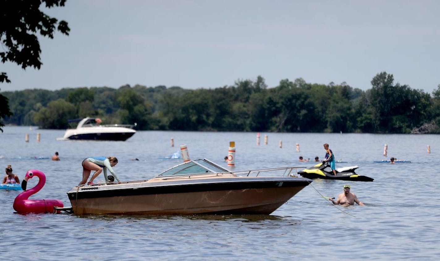 The Lake Minnetonka Association, in partnership with Life's a Beach Shoreline Services and Tonka Bay Marina, as well as some lake homeowners did their annual trash sweep, cleaning up trash left behind near Big Island left by the hundreds of boaters and fun seekers on July 4 and seen Wednesday, July 5, 2017, in Tonka Bay, MN. Here, homeowners and other Lake Minnetonka lovers joined the crew from Life's a Beach Shoreline Services in cleaning up trash from Lake Minnetonka.