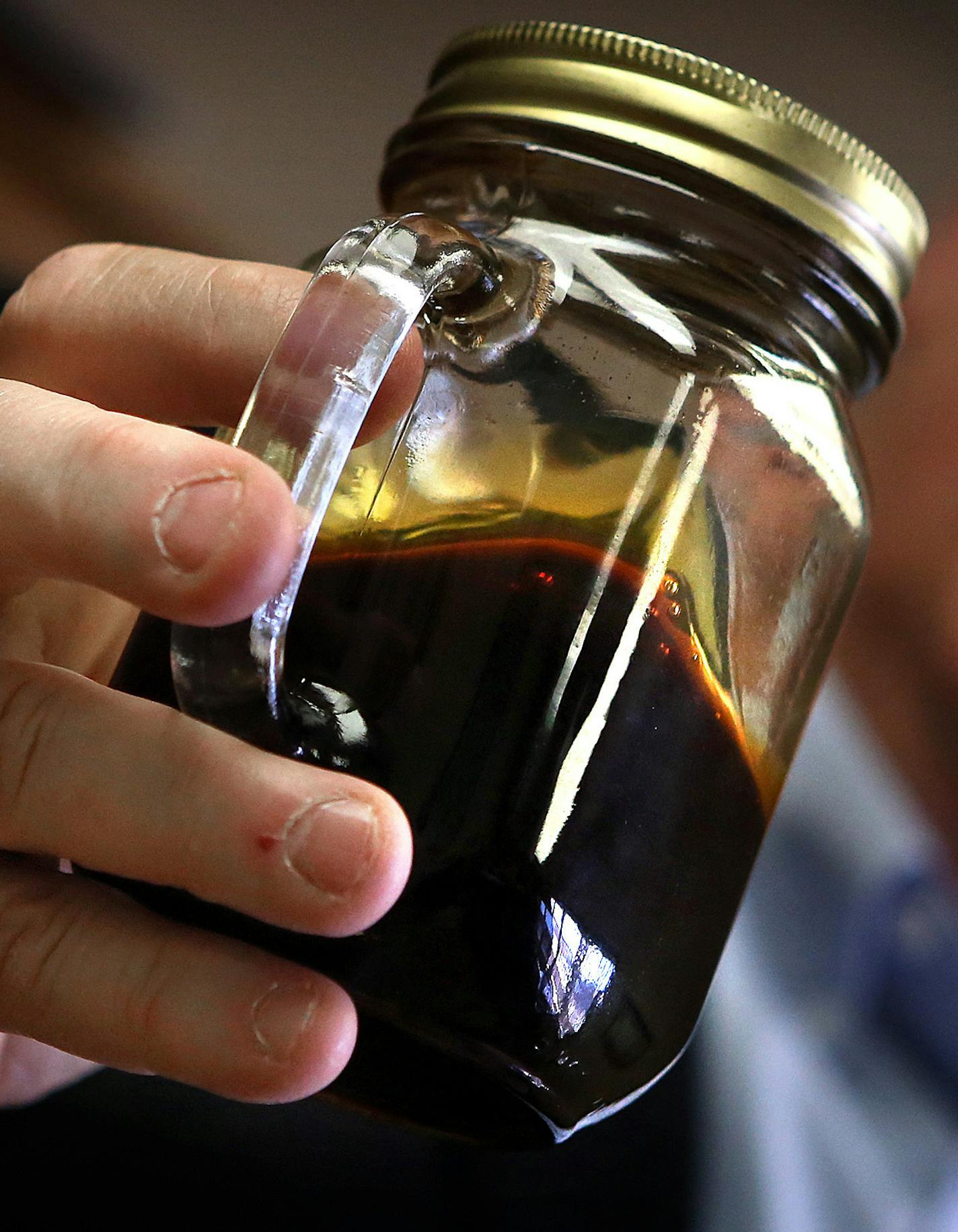 Williston Mayor E. Ward Koeser displayed a jar containing Bakken crude oil. ] (JIM GEHRZ/STAR TRIBUNE) / May 2, 2013 / 12:00 PM Williston, ND and region:&#xac;&#xea; BACKGROUND INFORMATIN-According to the latest U. S. Geological Survey estimate, there are 7.4 billion barrels of recoverable oil in Western North Dakota and Montana, more than twice the estimate from five years ago. There is nearly triple the amount of natural gas than earlier thought as well. As a result, the economic boom in the B