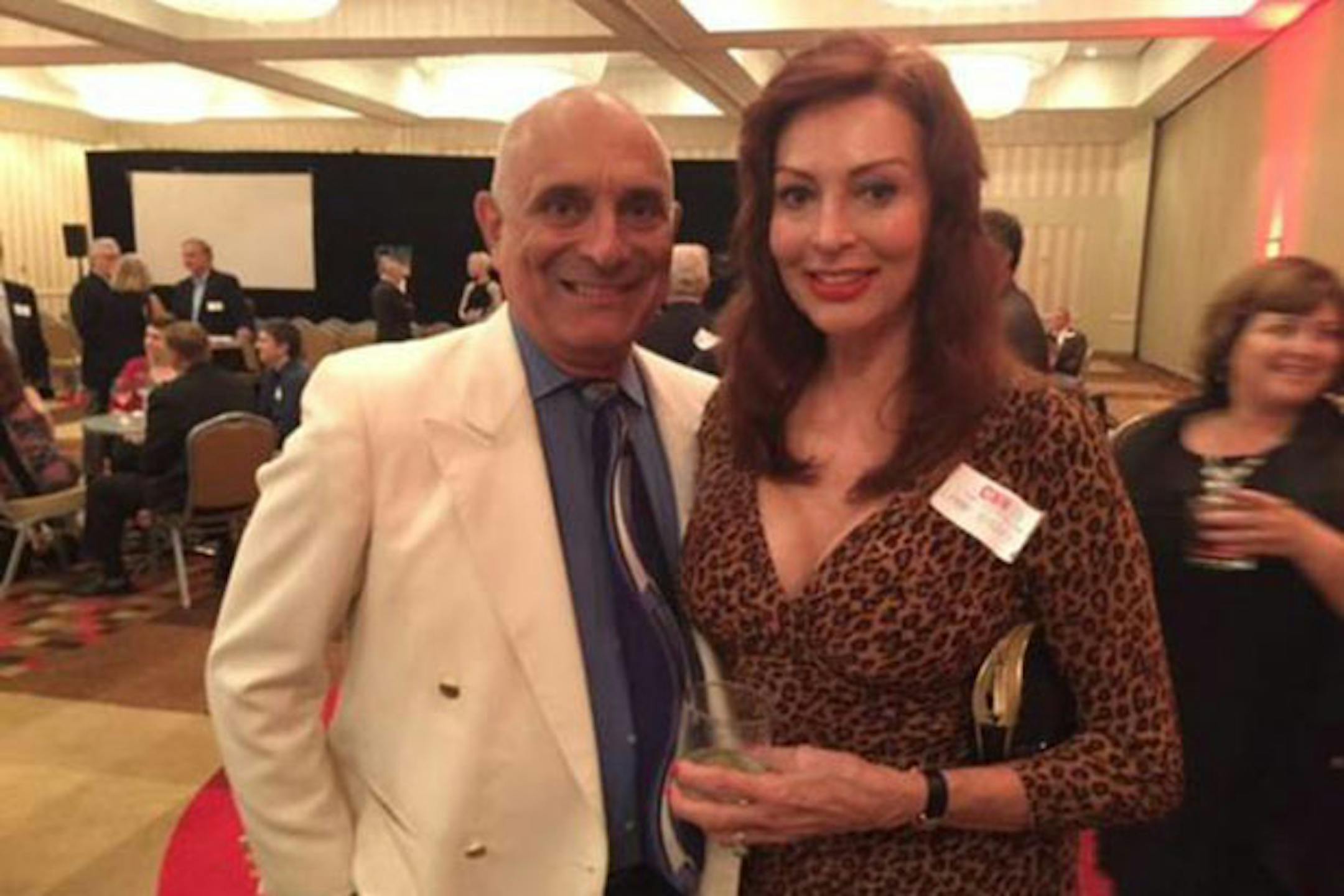 Former CNN Headline News anchor Lynne Russell poses with husband Chuck de Caro, also a former CNN reporter.