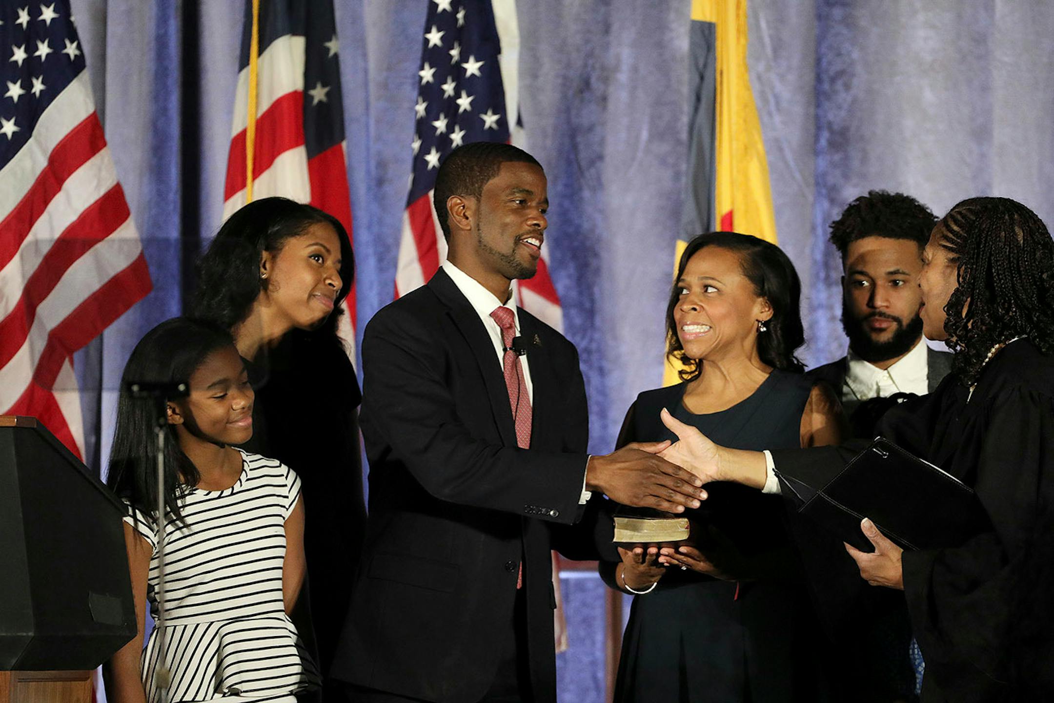 Melvin Carter and his wife Sakeena Carter were joined on stage by their family as Justice Tanya Bransford with the Fourth Judicial District administered the oath of office during Carter's swearing in ceremony as St. Paul mayor.