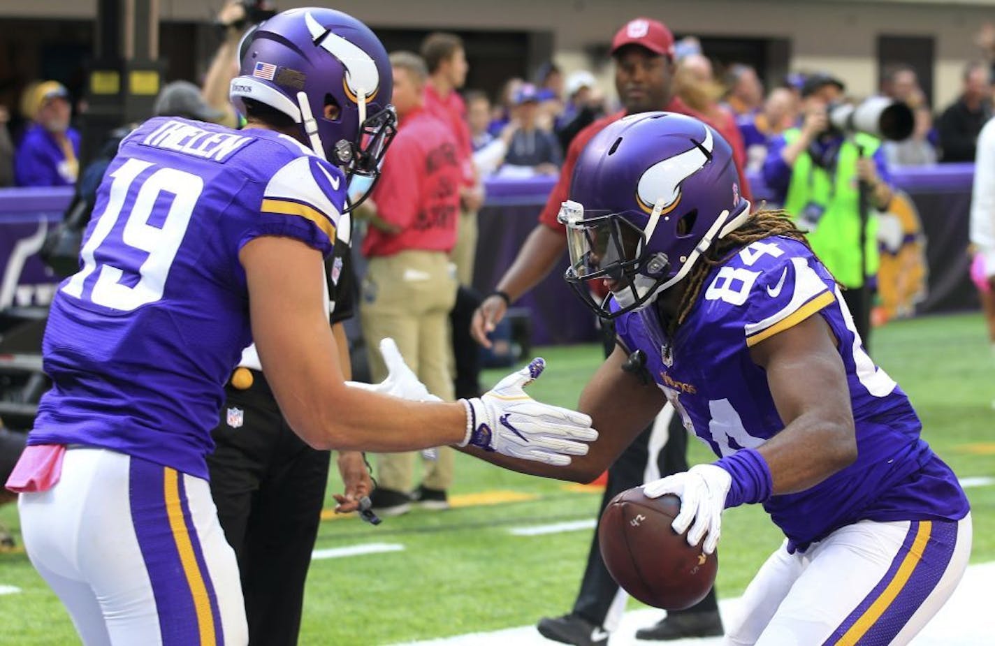 Minnesota Vikings wide receiver Cordarrelle Patterson, right, celebrates with teammate Adam Thielen, left, after catching a 9-yard touchdown pass during the second half of an NFL football game against the Houston Texans, Sunday, Oct. 9, 2016, in Minneapolis.