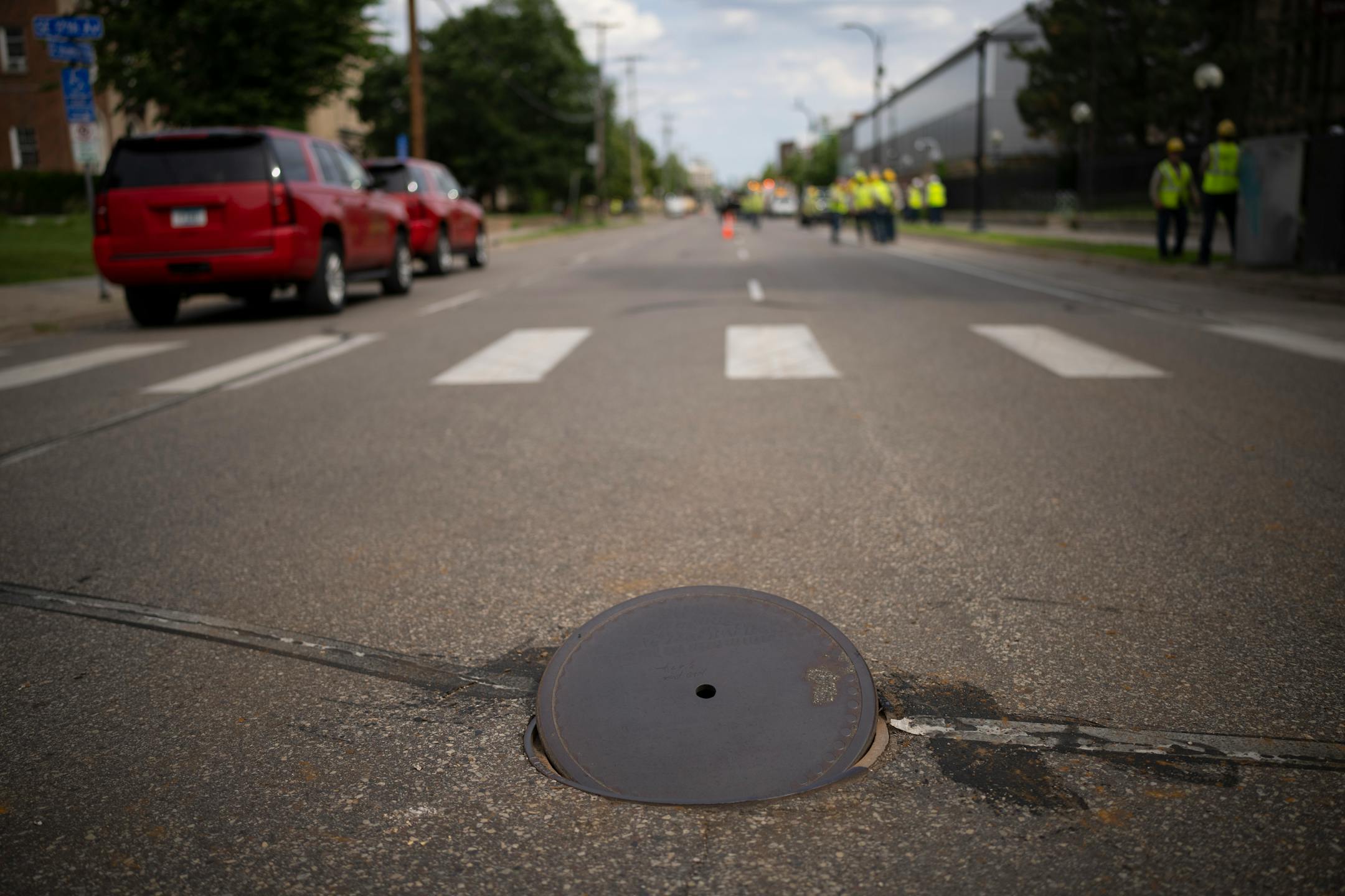 An open manhole cover on University Ave. SE at 17th Ave. SE Thursday afternoon in Minneapolis. A suspected gas leak resulted in the evacuation of fraternity houses on University Ave. SE across from the U of M campus.