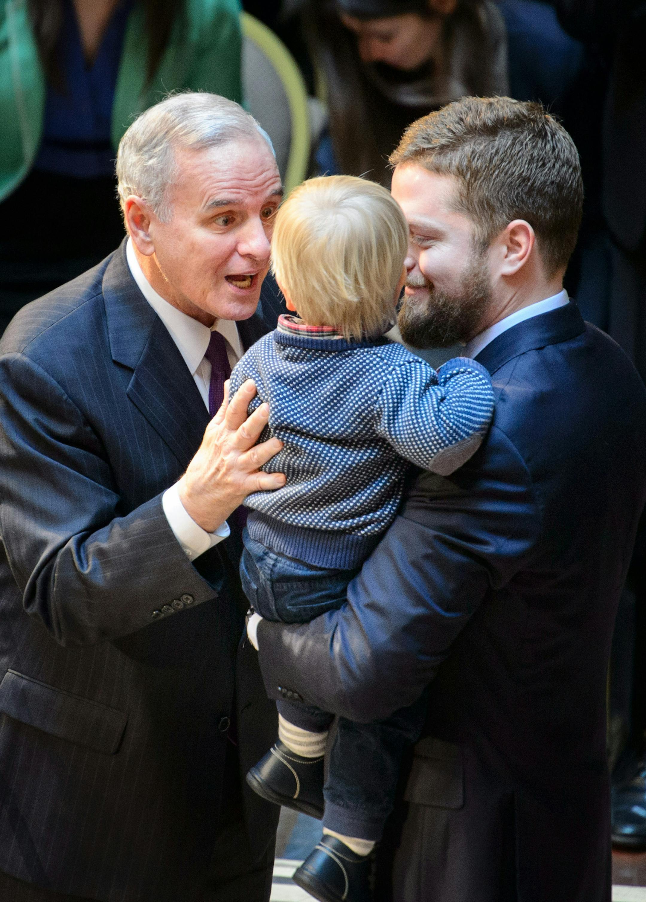 Governor Mark Dayton is sworn in greeted grandson Hugo held by Dayton's son Eric. ] GLEN STUBBE * gstubbe@startribune.com Monday January 5, 2015 Next Monday, January 5, Governor Mark Dayton and Lt. Governor-Elect Tina Smith will take the oath of office at an official inauguration ceremony beginning at 12:00pm at the Landmark Center in St. Paul. 138026