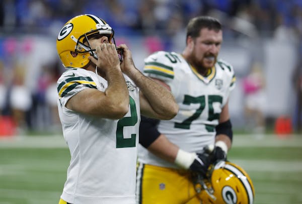 Green Bay Packers kicker Mason Crosby (2) walks off the field after missing his fourth field goal during the second half of an NFL football game again