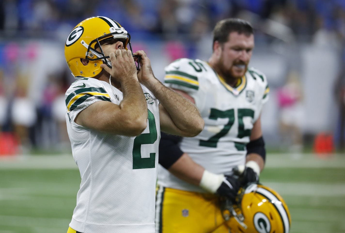 Green Bay Packers kicker Mason Crosby (2) walks off the field after missing his fourth field goal during the second half of an NFL football game against the Detroit Lions, Sunday, Oct. 7, 2018, in Detroit. (AP Photo/Paul Sancya)