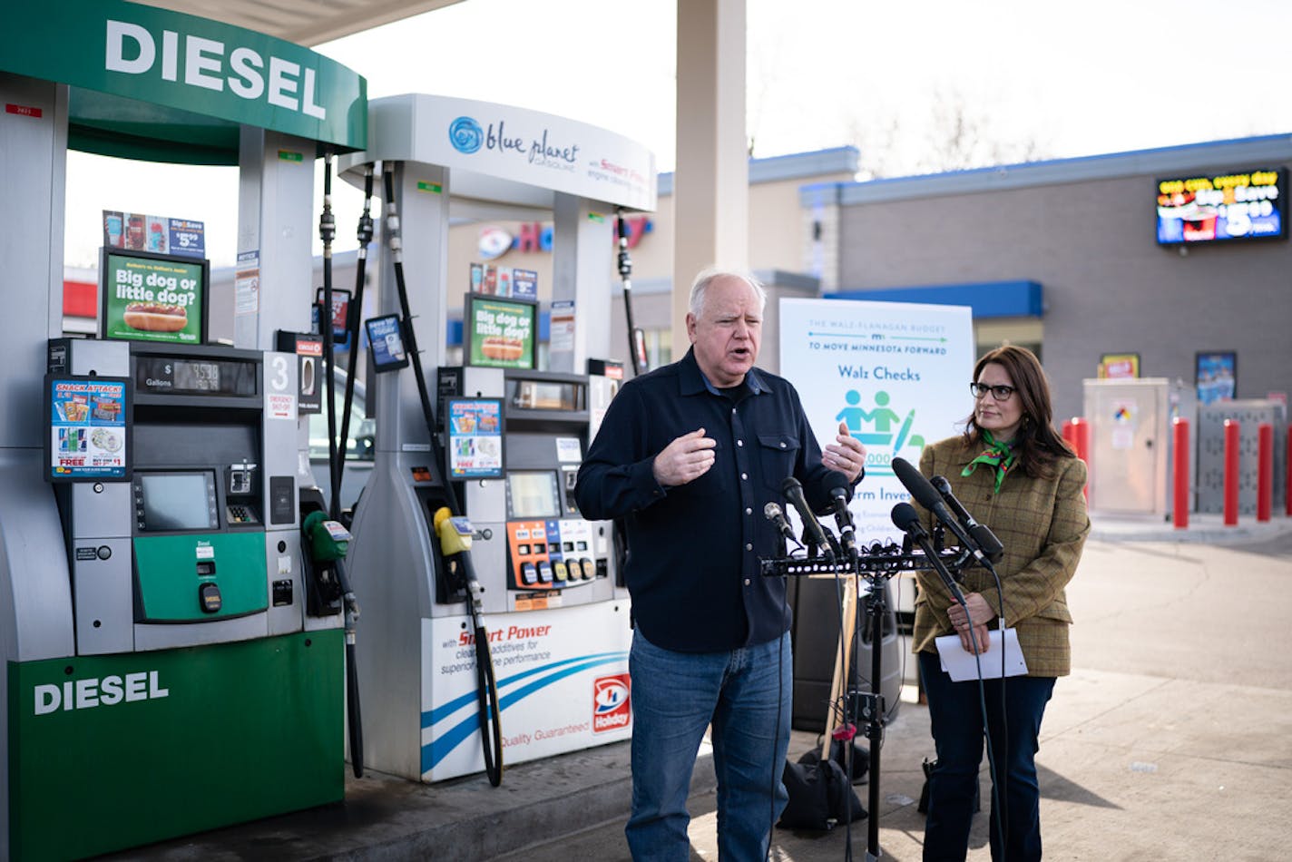 Gov. Tim Walz and Lt Gov. Peggy Flanagan announced that they want to spend more of the record-breaking projected state budget surplus on financial aid for retirees, improving the public health system and sending out sizable tax rebate checks to millions of Minnesotans, calling them Walz Checks, Thursday, March 17, 2022, New Hope, Minn. The announcement was made in the parking lot of a Holiday gas station. ] GLEN STUBBE • glen.stubbe@startribune.com