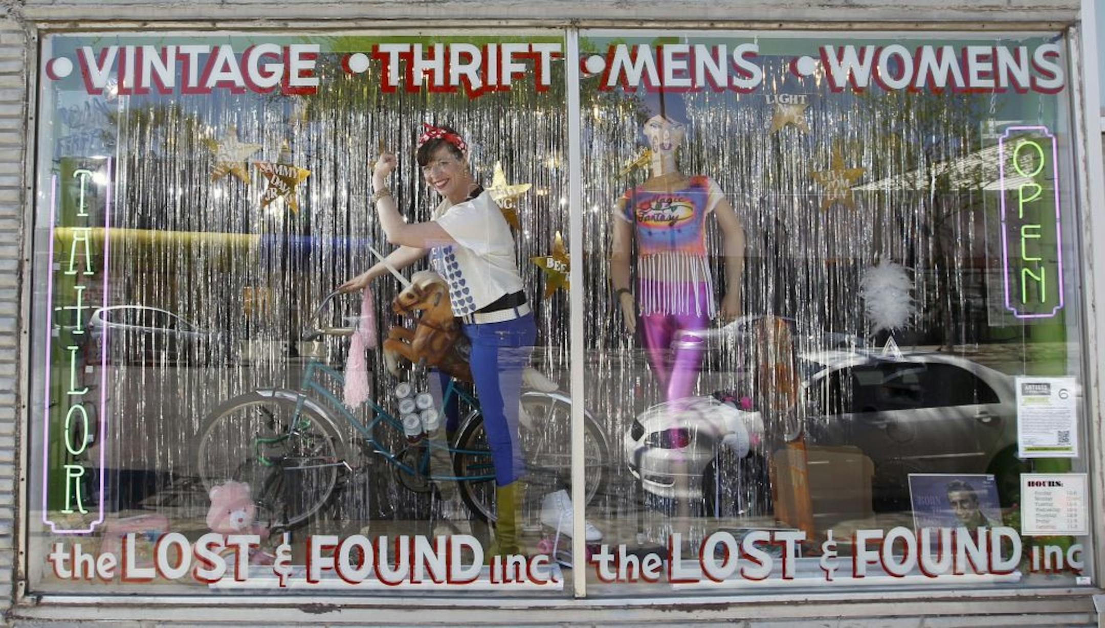 Joan Vorderbruggen, left, dropped in on her "little girl playing grownup"-themed window at the Lost and Found thrift store in Minneapolis' Whittier neighborhood. "It's my tribute to the comedic traditions of Gilda Radner and Lily Tomlin," she said.