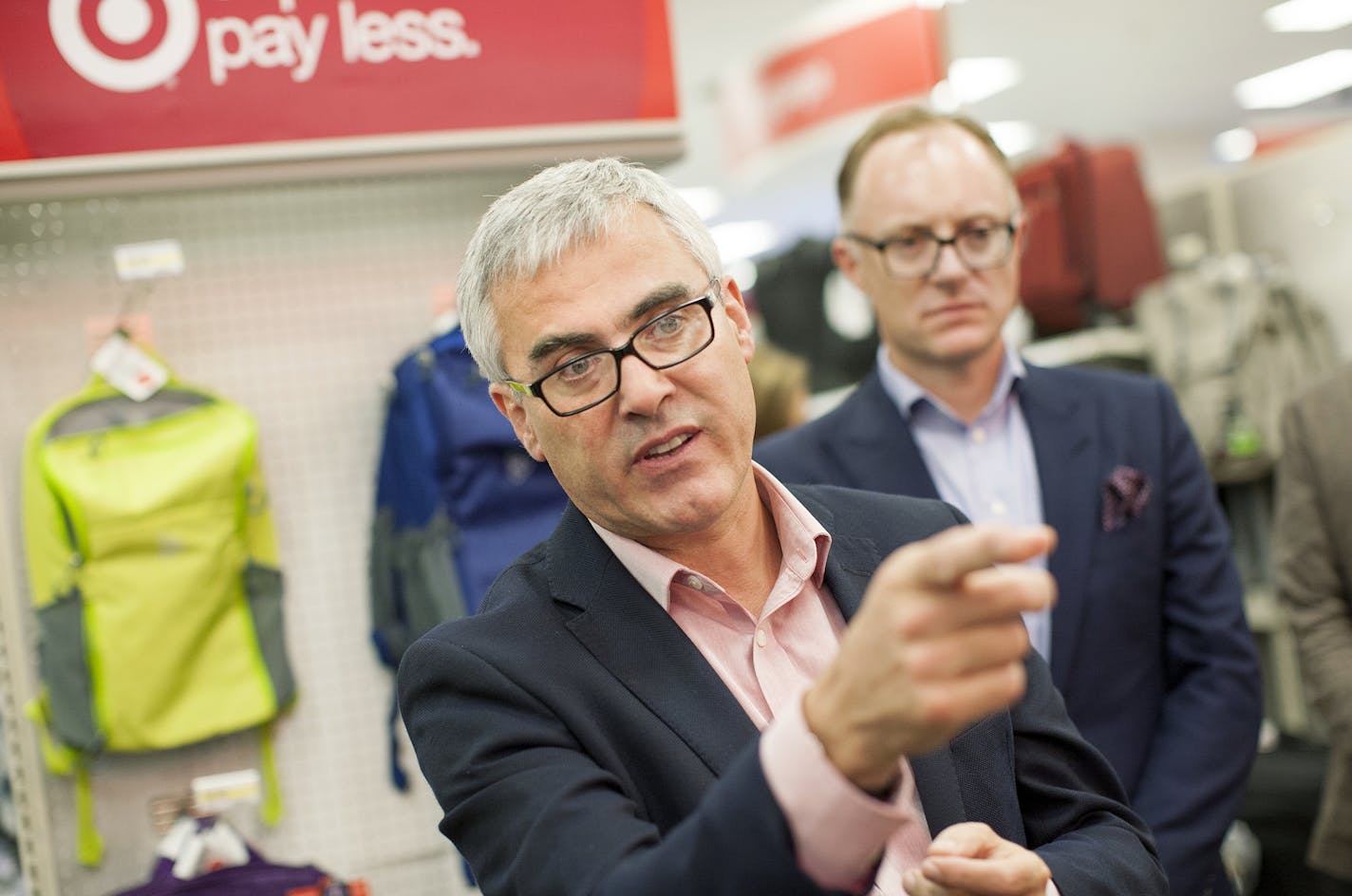 Mike McNamara, Chief Information Officer at Target, describes how RFID scanners can greatly increase the speed and efficiency of tracking inventory at the Target store on Nicollet Mall in Minneapolis September 15, 2015. At right is Jason Goldberger, President of Target.com and Mobile. (Courtney Perry/Special to the Star Tribune)