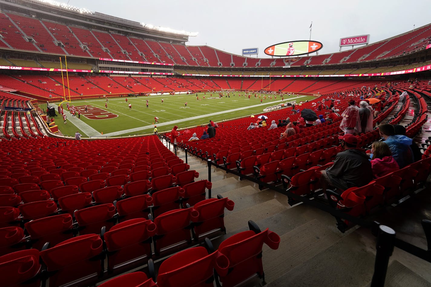 Fans watch the Kansas City Chiefs during NFL football training camp Saturday, Aug. 29, 2020, at Arrowhead Stadium in Kansas City, Mo. The Chiefs opened the stadium to 5,000 season ticket holders to watch practice as the team plans to open the regular season with a reduced capacity of approximately 22 percent of normal attendance. (AP Photo/Charlie Riedel)