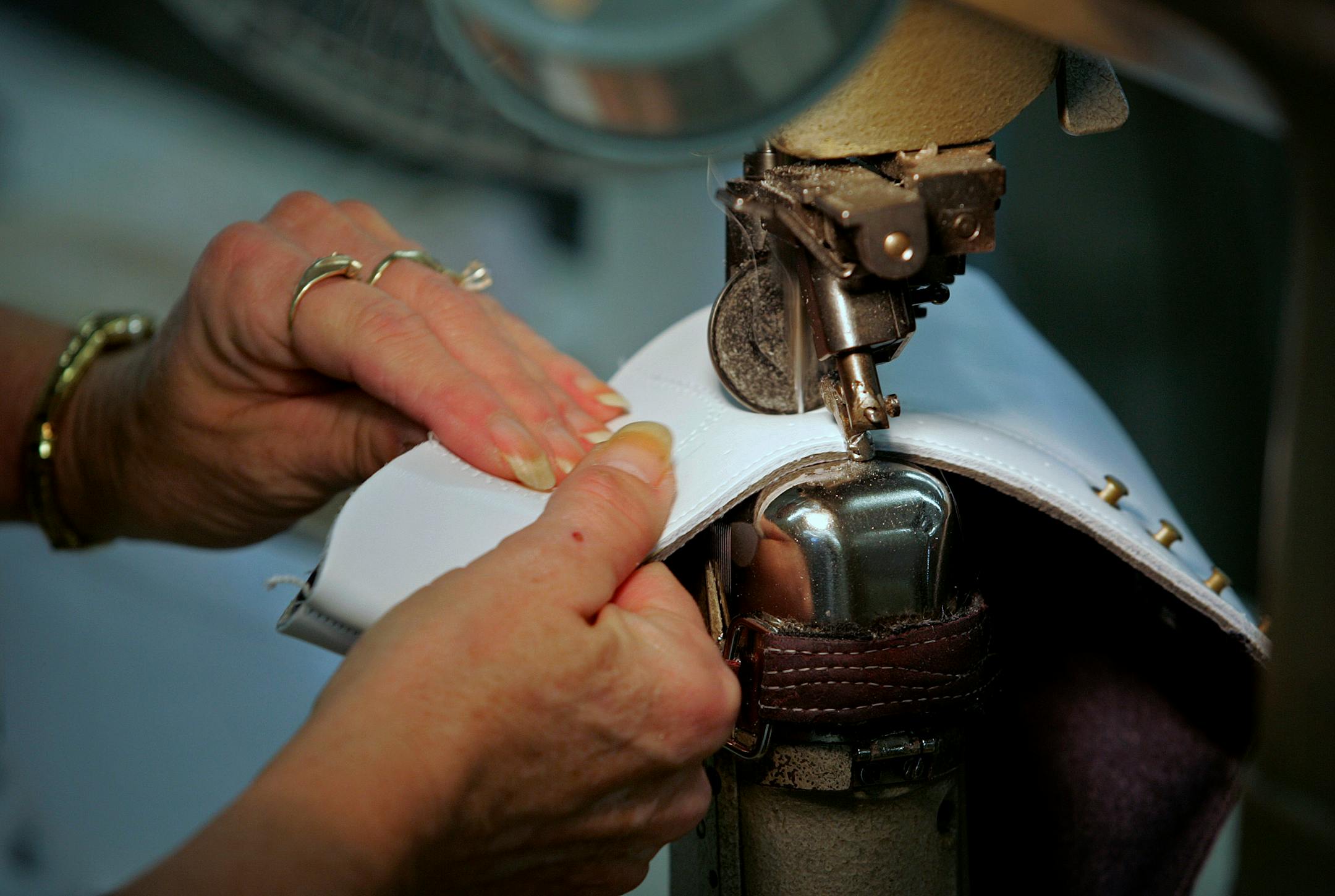 A Riedell Skate Company employee added stitching to a skate boot.