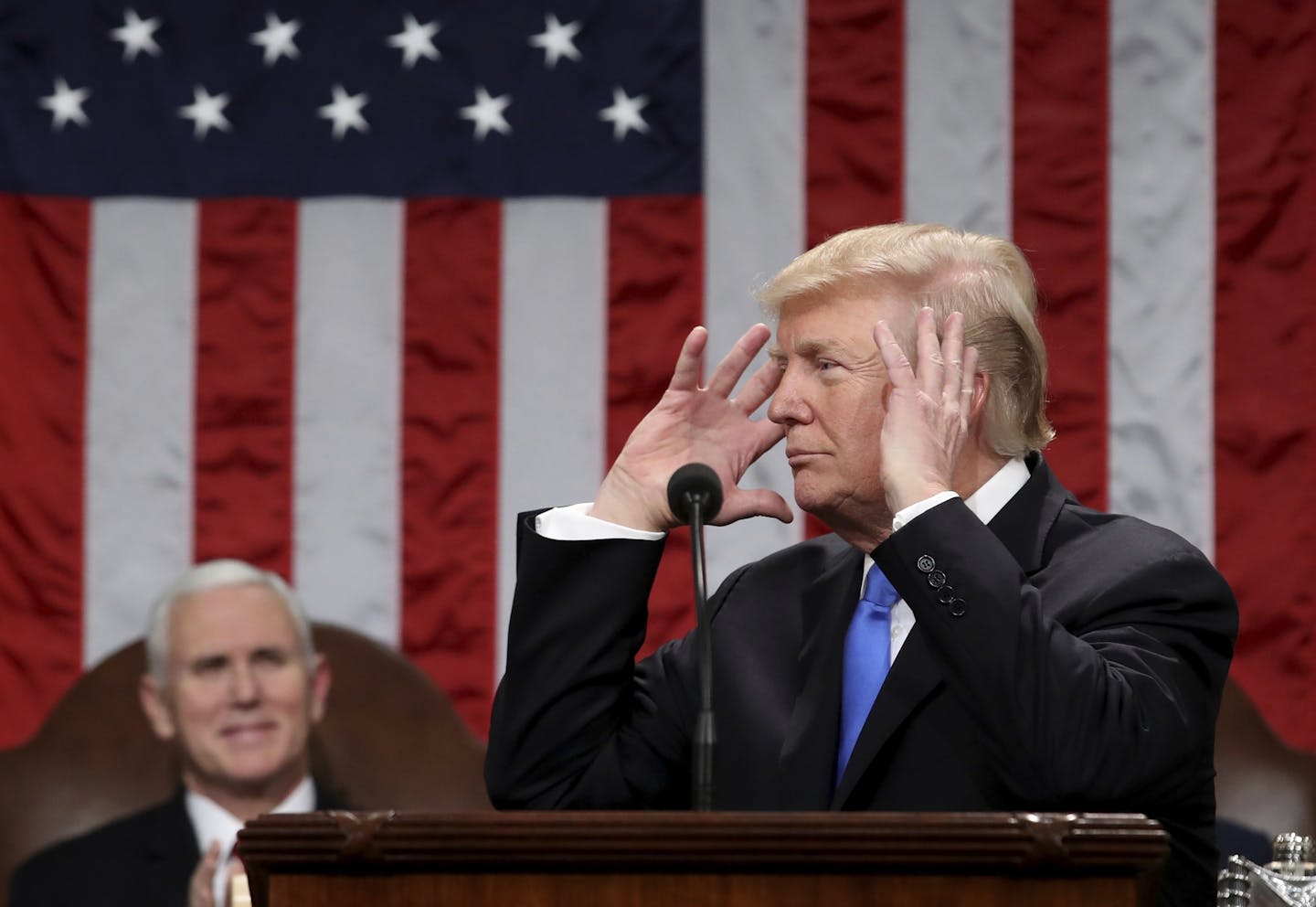 President Donald Trump gestures during his first State of the Union address in the House chamber of the U.S. Capitol to a joint session of Congress Tuesday, Jan. 30, 2018 in Washington.