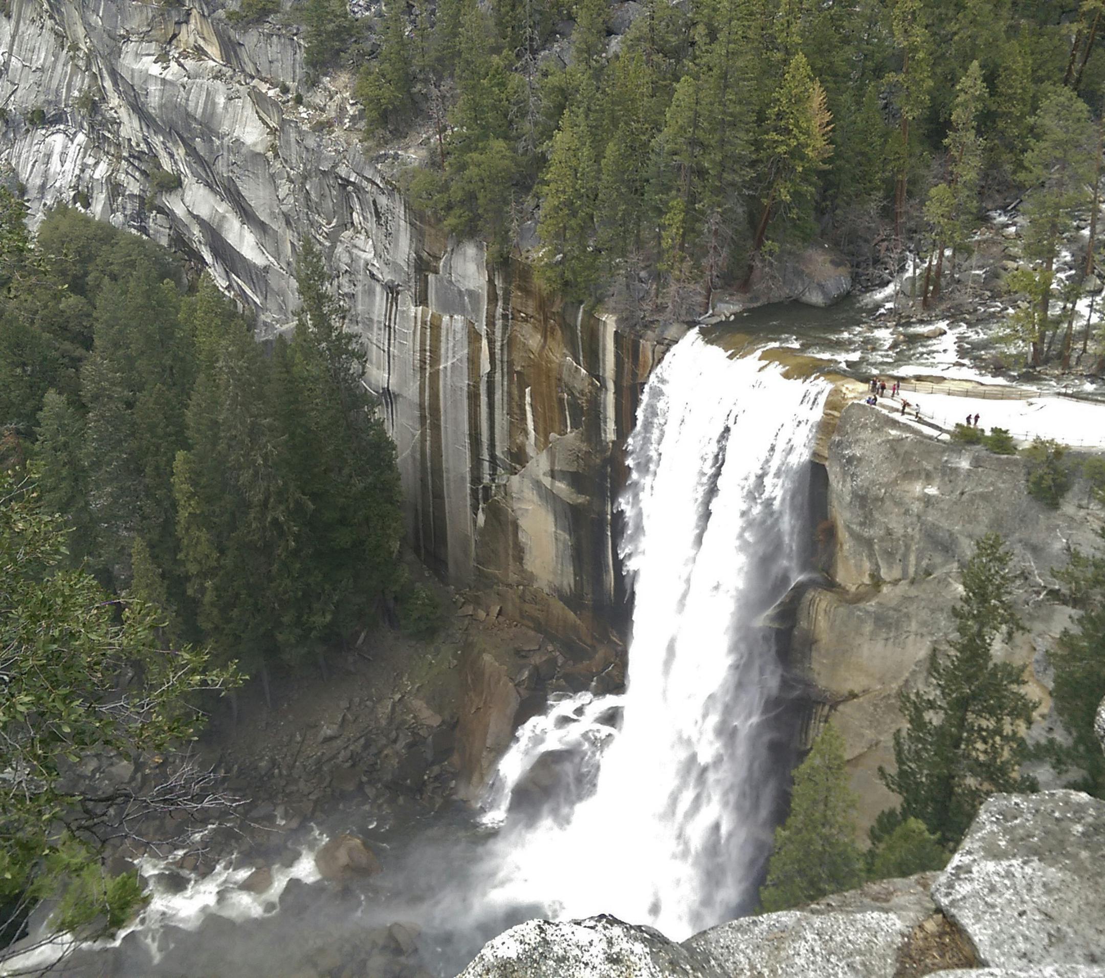 In this March 28, 2016 photo provided by the National Park Service, water plunges 300 feet over Vernal Fall onto the Merced River in Yosemite National Park, Calif. Waterfalls in Yosemite National Park will likely reach peak flows between now and May. Thunderstorms, showers and intense periods of rain on top of snow have unleashed snowmelt in Yosemite Valley. (National Park Service via AP)
