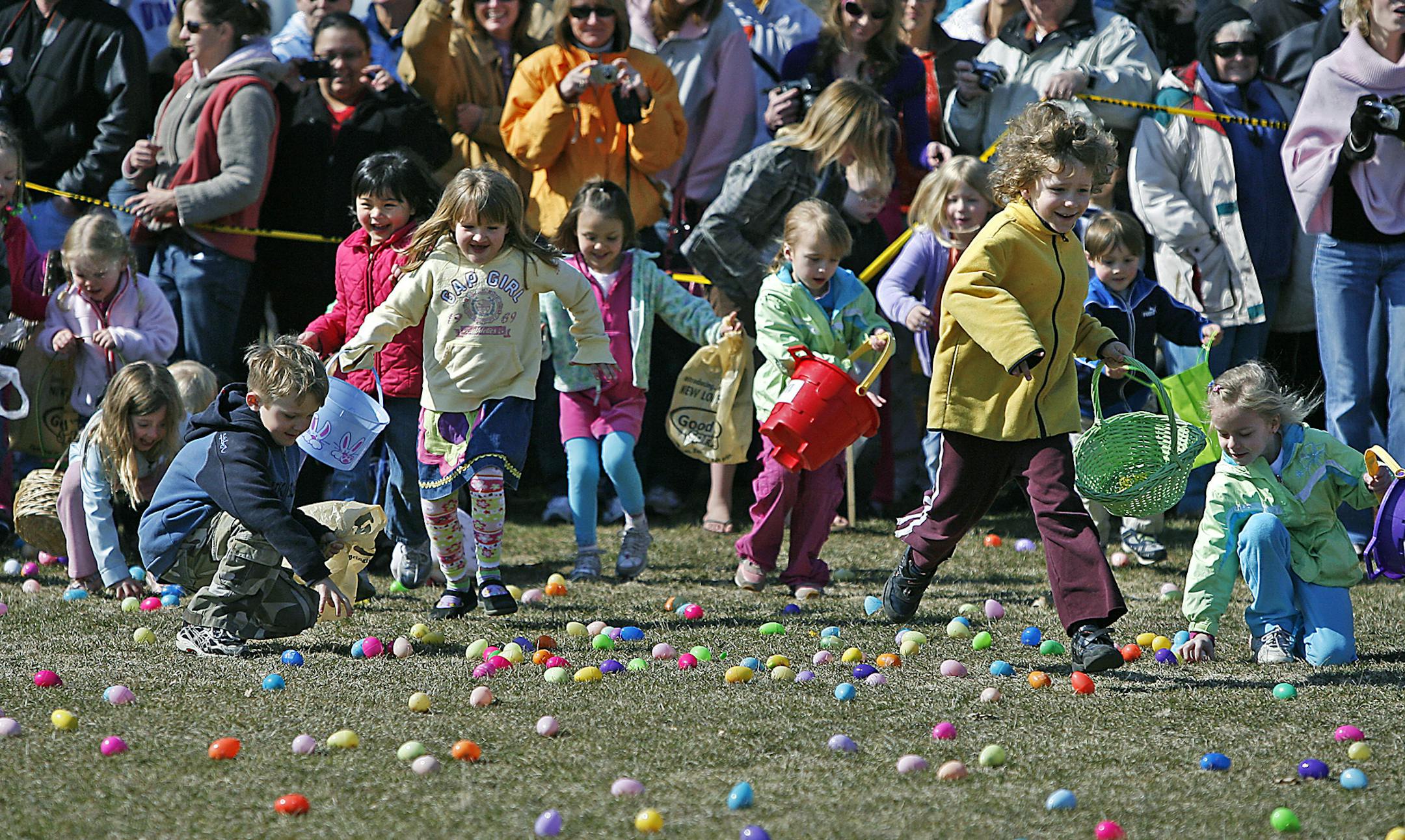 ELIZABETH FLORESï eflores@startribune.com April 11, 2009 - Excelsior, MN - Children raced to grab candy-filled eggs during the 11th Annual Community Easter Egg Hunt at Excelsior Commons Park. The event, which provided 8,000 eggs was hosted by Our Savior Lutheran Church. A firetruck, puppet shows, food, and entertainment were availabe to the more than 500 children from the West metro area. The event started ten years ago with 200 eggs.