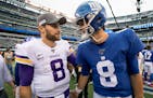 Vikings quarterback Kirk Cousins, left, speaks with Giants quarterback Daniel Jones at the end of a game in 2019.