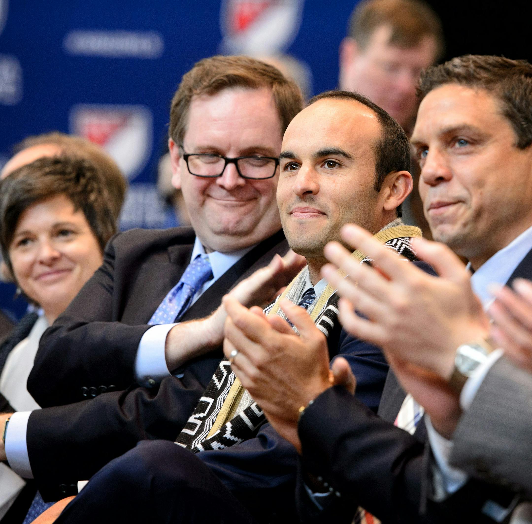 Mark Abbott, president and deputy commissioner of MLS patted soccer star Landon Donovan as he was introduced at the ceremony. ] GLEN STUBBE * gstubbe@startribune.com Wednesday, March 25, 2015 Major League Soccer, Commissioner Don Garber and Dr. Bill McGuire announced that Minnesota will be awarded an expansion soccer team.