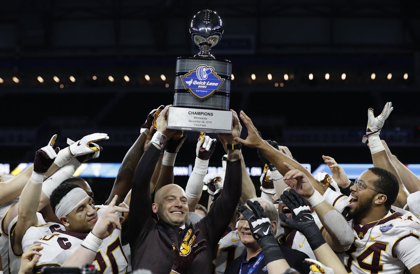 Coach P.J. Fleck and the Gophers hoisted the Quick Lane Bowl champions trophy after stomping Georgia Tech 34-10 in Detroit on Wednesday.