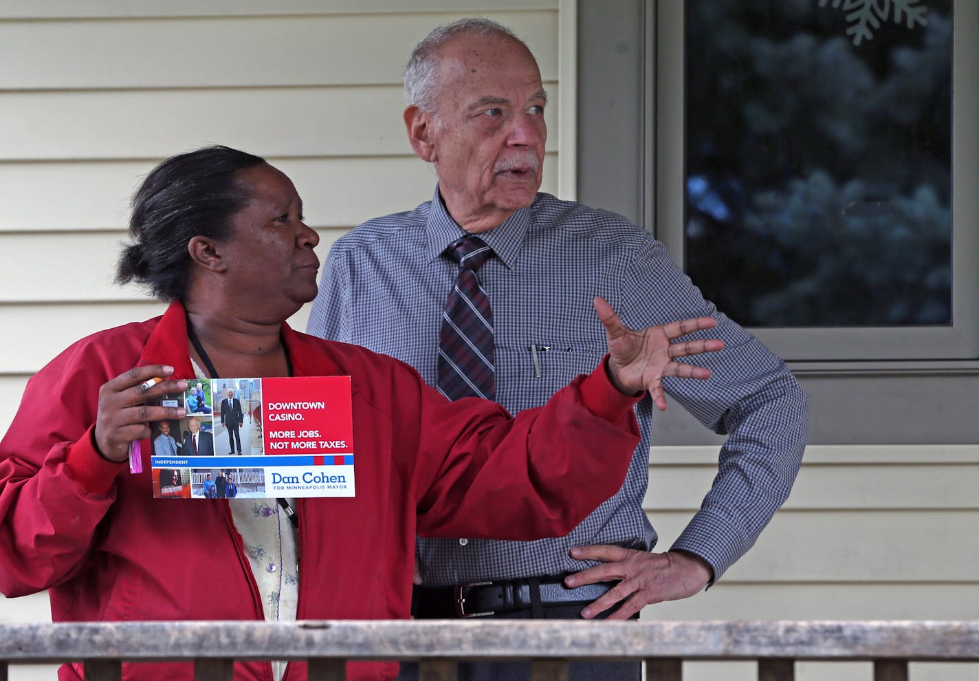 (left to right) Northside resident Robin Nickens talked with Minneapolis mayoral candidate Dan Cohen, as he went door to door near Penn Ave North and Hwy 55, on 10/12/13. Bisping/Star Tribune bbisping@startribune.com Robin Nickens, Dan Cohen/source.