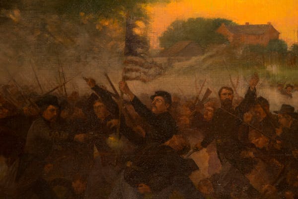 Detail from "Battle of Gettysburg," a painting by Rufus Zogbaum, shows Col. William Colvill standing behind the tattered flag and rallying his men for