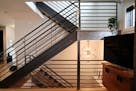 Update a staircase with modern spindles and railings.