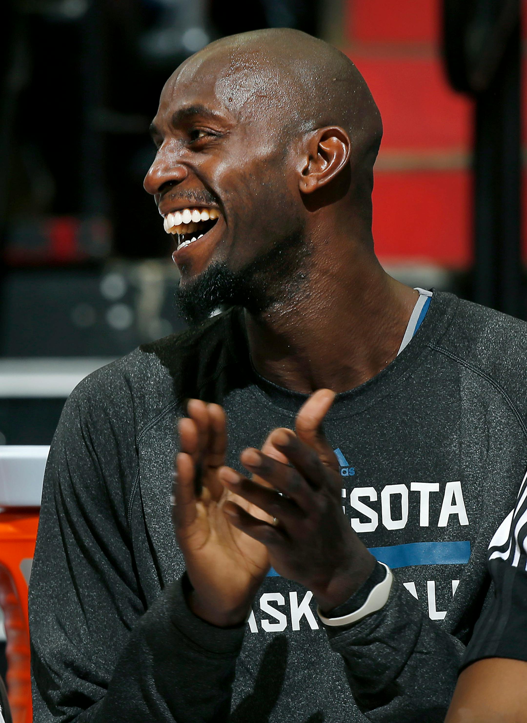 Kevin Garnett (21) laughed after seeing an old video of him from his early days with the Timberwolves played on the big screen.