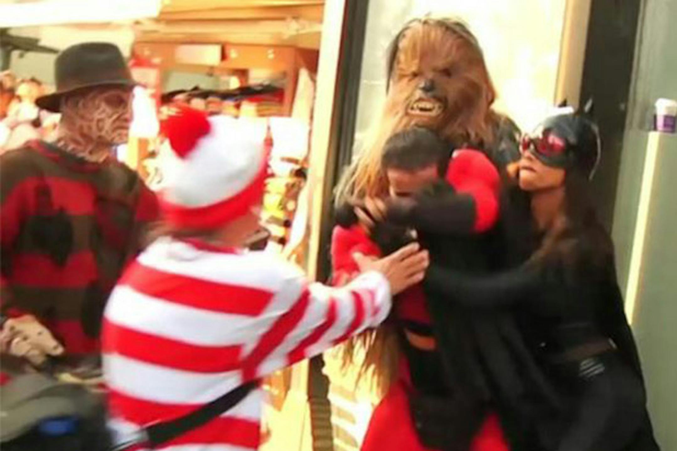 A screen capture of the brawl between Mr. Incredible and Batgirl, with Chewbacca, Waldo and Freddy Krueger intervening.