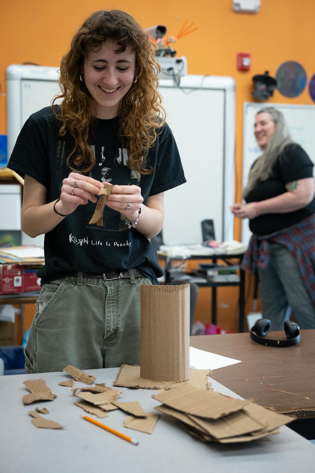 Echo Columb, a junior at Avalon in St. Paul, creates an art structure out of cardboard. Teacher Mickey Jurewicz. background, said the students' joy at having their work displayed was evident: 